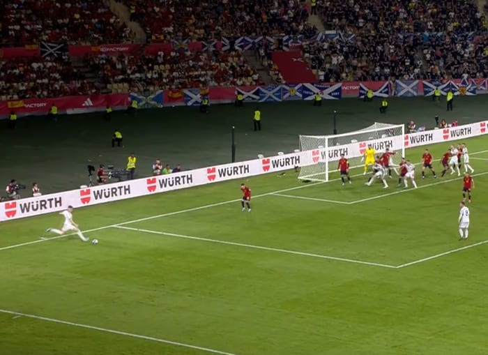 Scott McTominay pictured (left) shooting from a free-kick during Scotland's Euro 2024 qualifier against Spain in October 2023